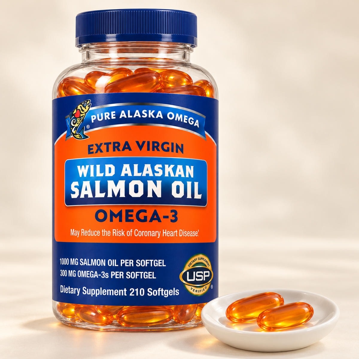 Pure Alaska Omega 210-softgel salmon oil bottle with two amber softgels on a dish