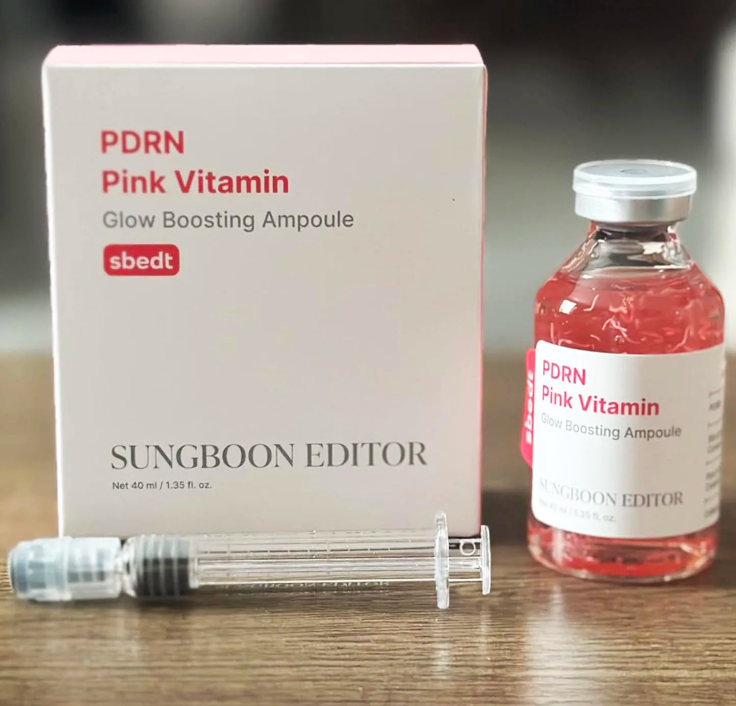 Pink vitamin brightening serum ampoule bottle