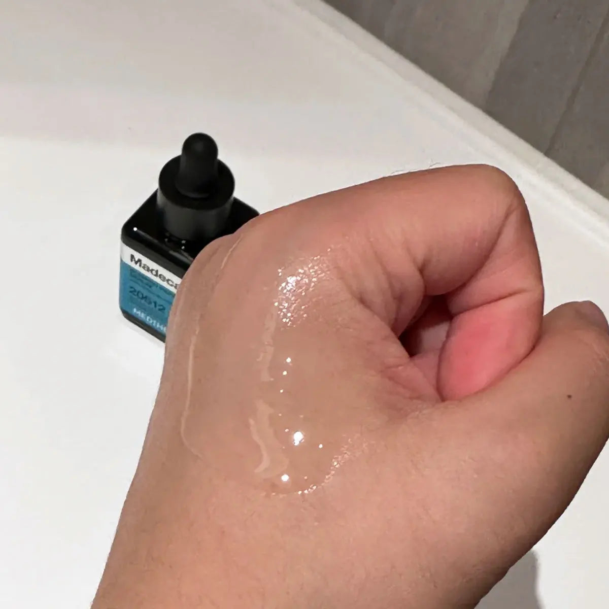 Bottle of nourishing facial serum with breathable formula for soft, comfortable skin.