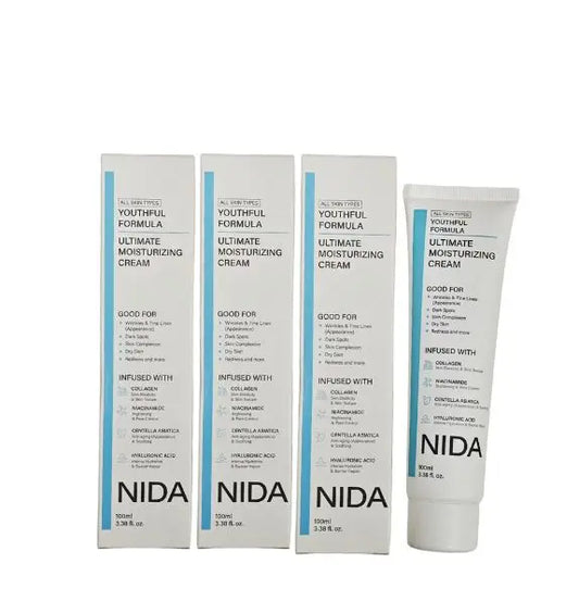 NIDA Natural Plant Extract Face Cream — Natural Plant Extract — White and blue squeeze tubes with boxes on white background