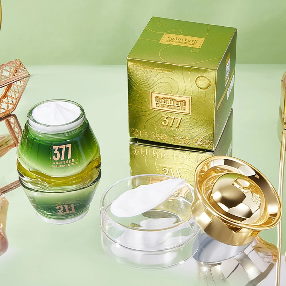 SkinSwaag Beauty — GUSHIYUTA 377 Brightening Luxury Glow Cream — Gold and white jar on white background