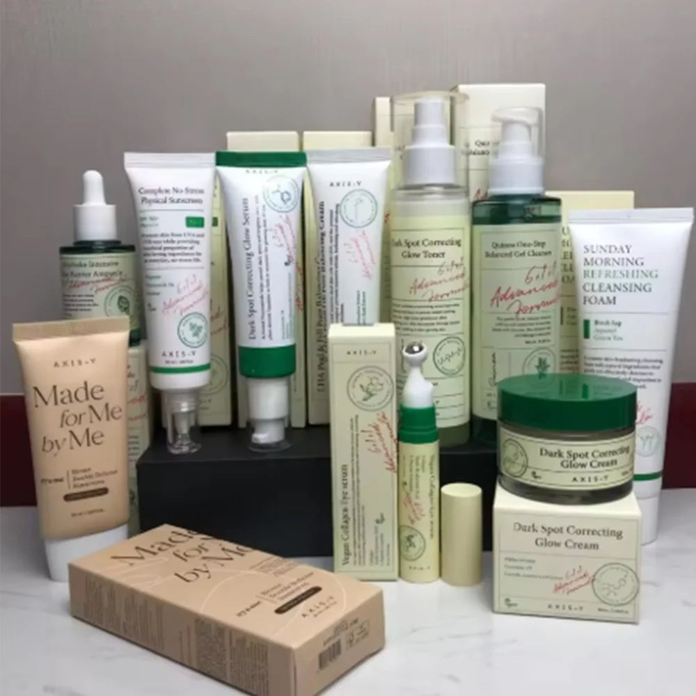 Skincare set with pore-balancing serum and dark spot treatment bottles on clean background.