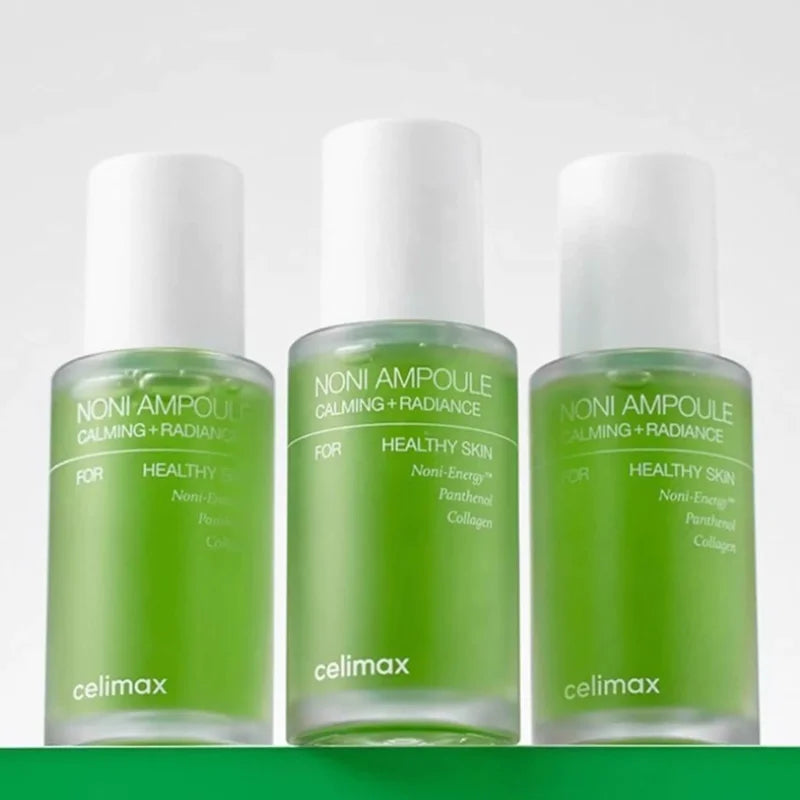 Celimax Noni Fruit Extract Energy Ampoule — Noni Fruit Extract — Green glass dropper bottles on white background