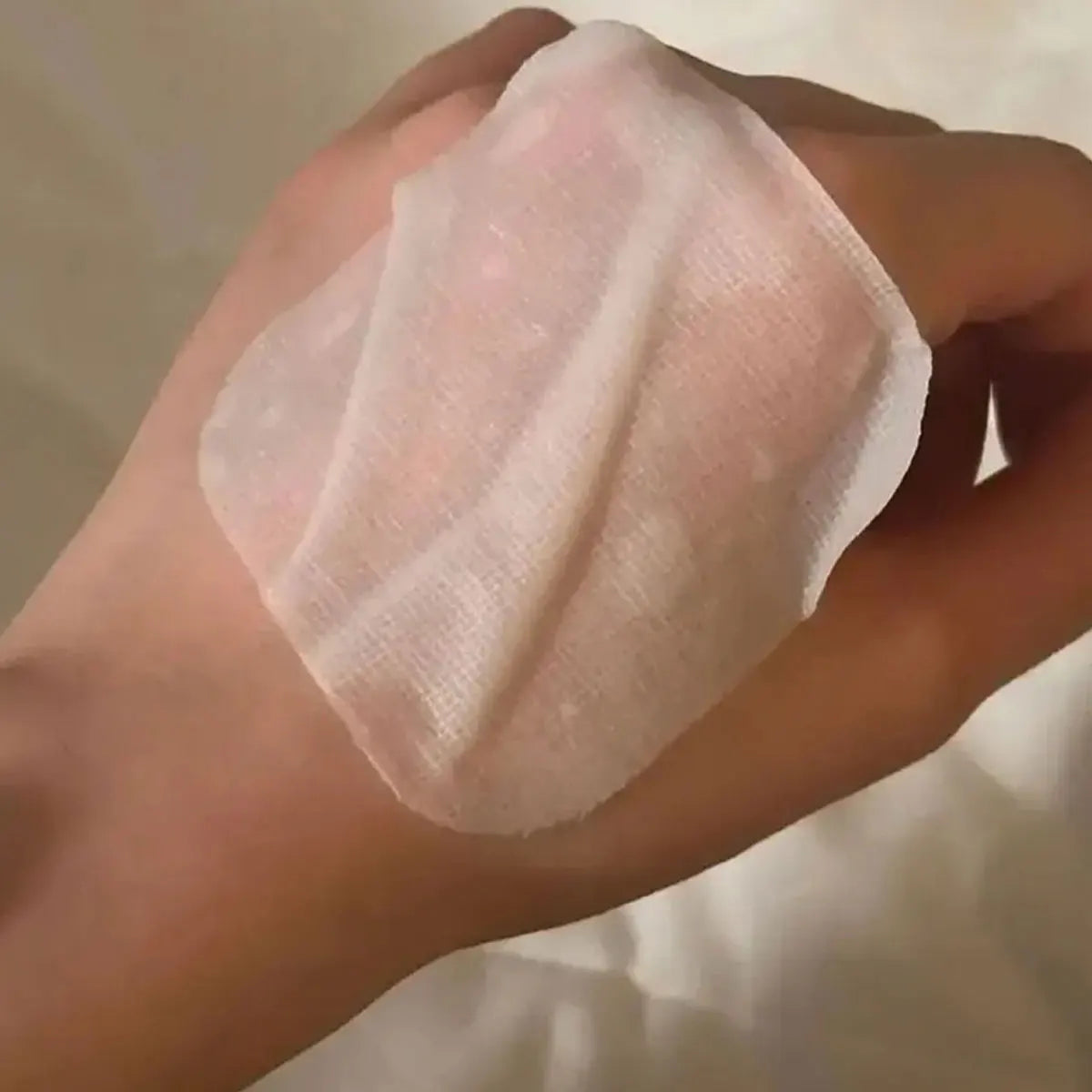 Cotton toner pads in a round container for moisturizing and hydrating skin