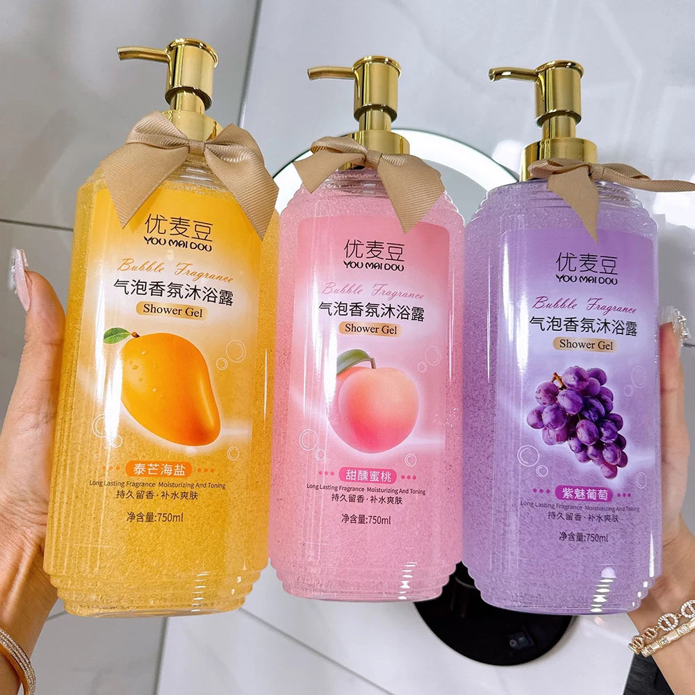 YUMAIDOO Mango Peach Bubble Shower Gel — Mango & Peach — Set of three clear pump bottles with fruit illustrations and ribbon bows on white background