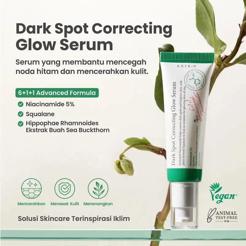 Dark spot correcting glow serum bottle with dropper on clean background