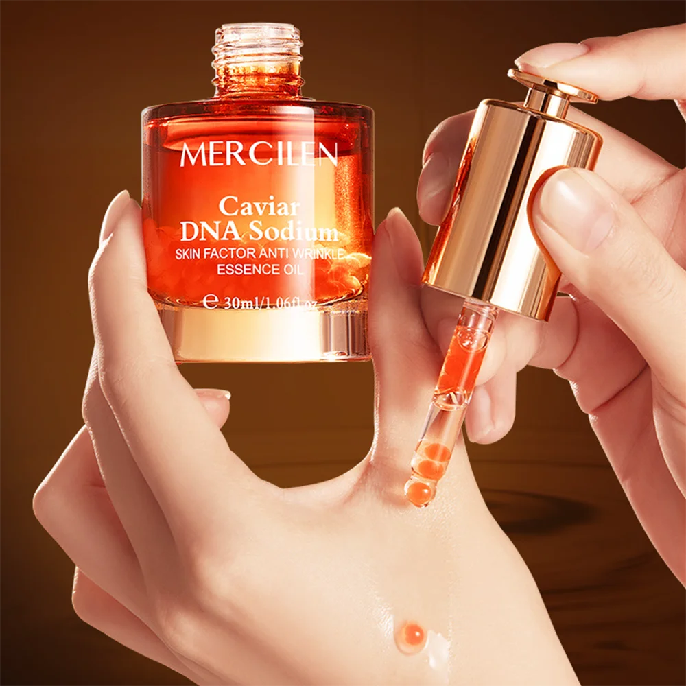 NIDA Caviar DNA Facial Essence Oil — Caviar DNA & Sodium Skin Factor — Bottle front view with MERCILEN branding close-up