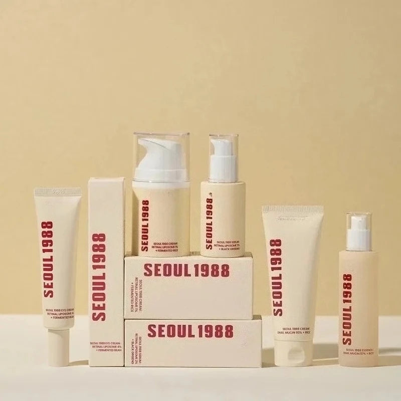 Seoul 1988 Retinol Ginseng Snail Serum Set — Retinol, Ginseng & Snail — Gold-toned serum bottle set on white background
