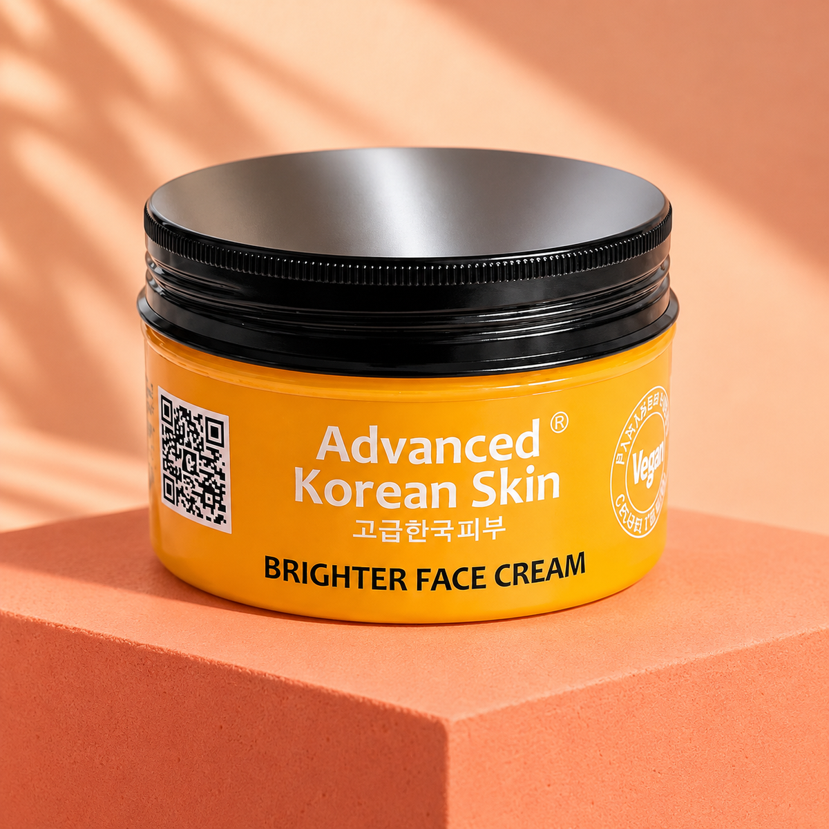 Advanced Korean Skin Brighter Face Cream closed jar on a coral display block