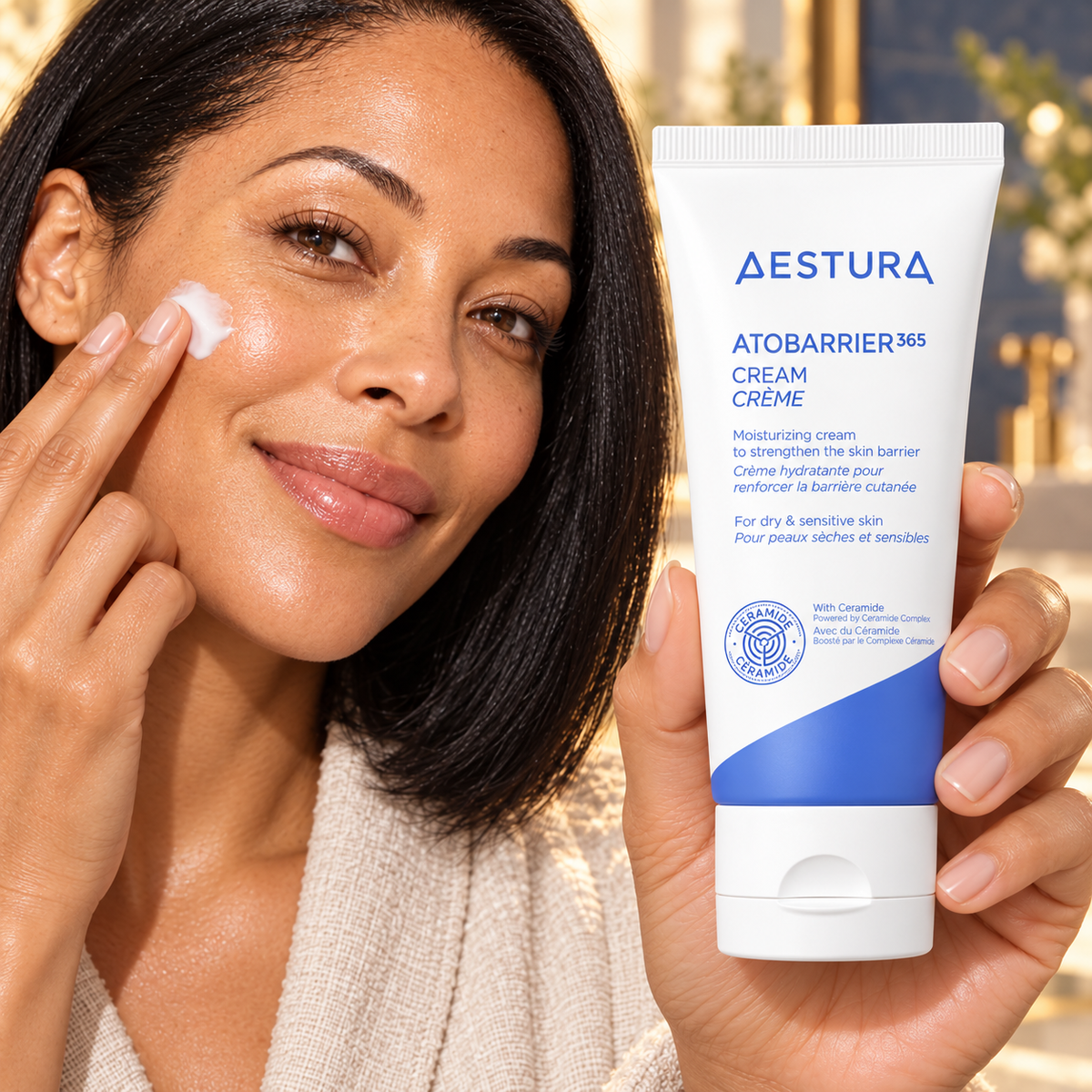 Original mid-thirties model demonstrating aestura skincare with a prominent readable product label