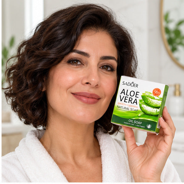 SADOER Aloe Vera Smooth Cleansing Natural Soap held by an adult woman