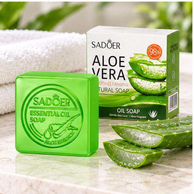 SADOER Aloe Vera Smooth Cleansing Natural Soap with aloe and a folded towel