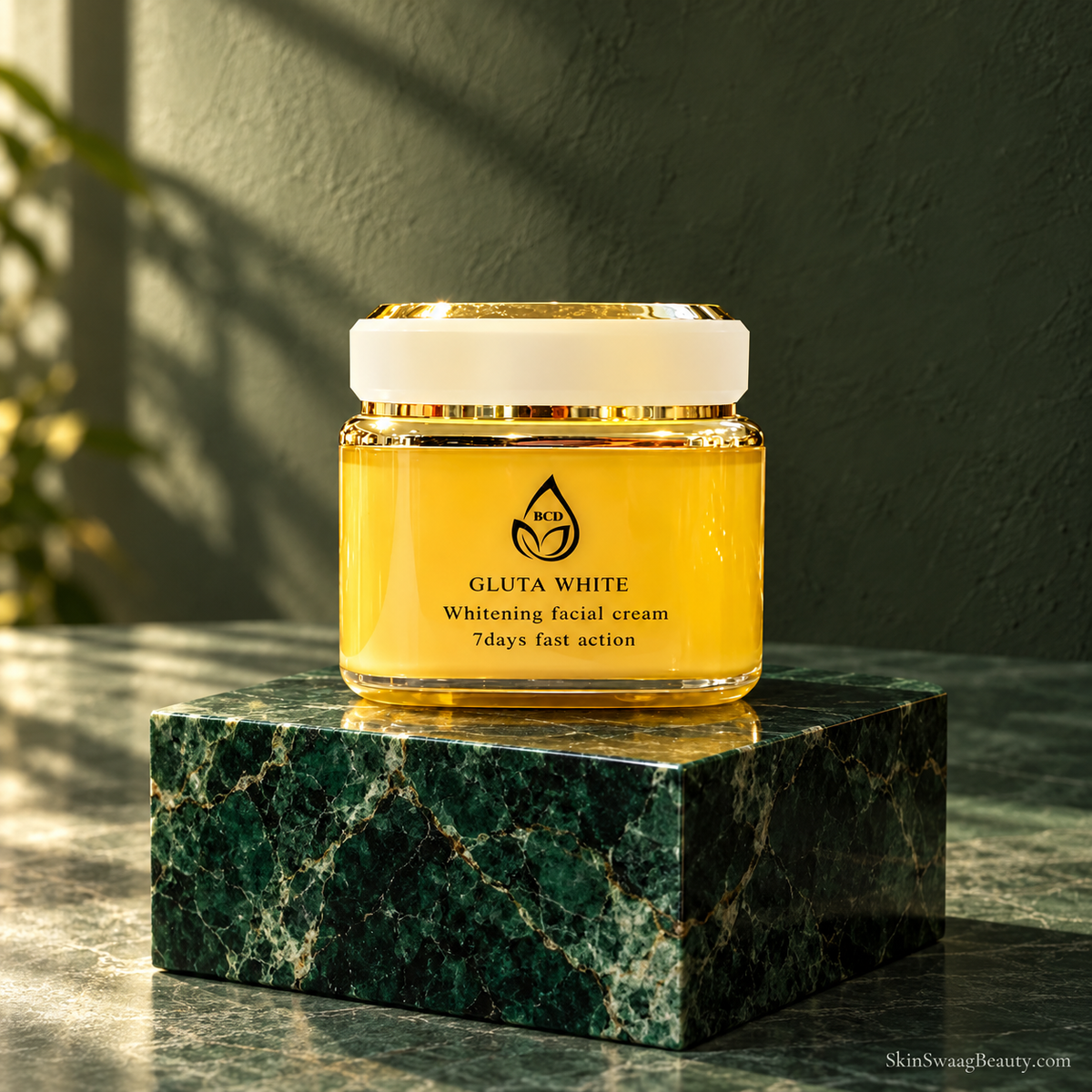 BCD Gluta White Facial Cream closed jar on emerald stone; styled product-only image, props not included.