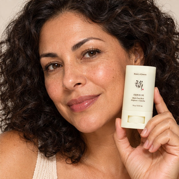 Beauty of Joseon Matte Sun Stick: Mugwort + Camelia — 18 g — model holding product
