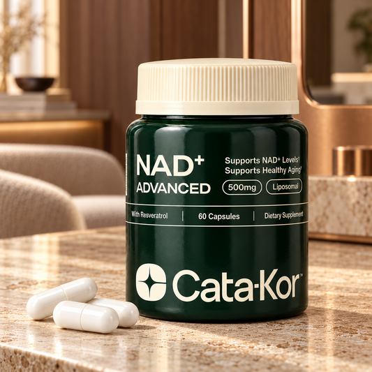 Cata-Kor NAD+ Advanced Liposomal 500 mg, 60-capsule bottle on a warm travertine vanity in an upscale interior
