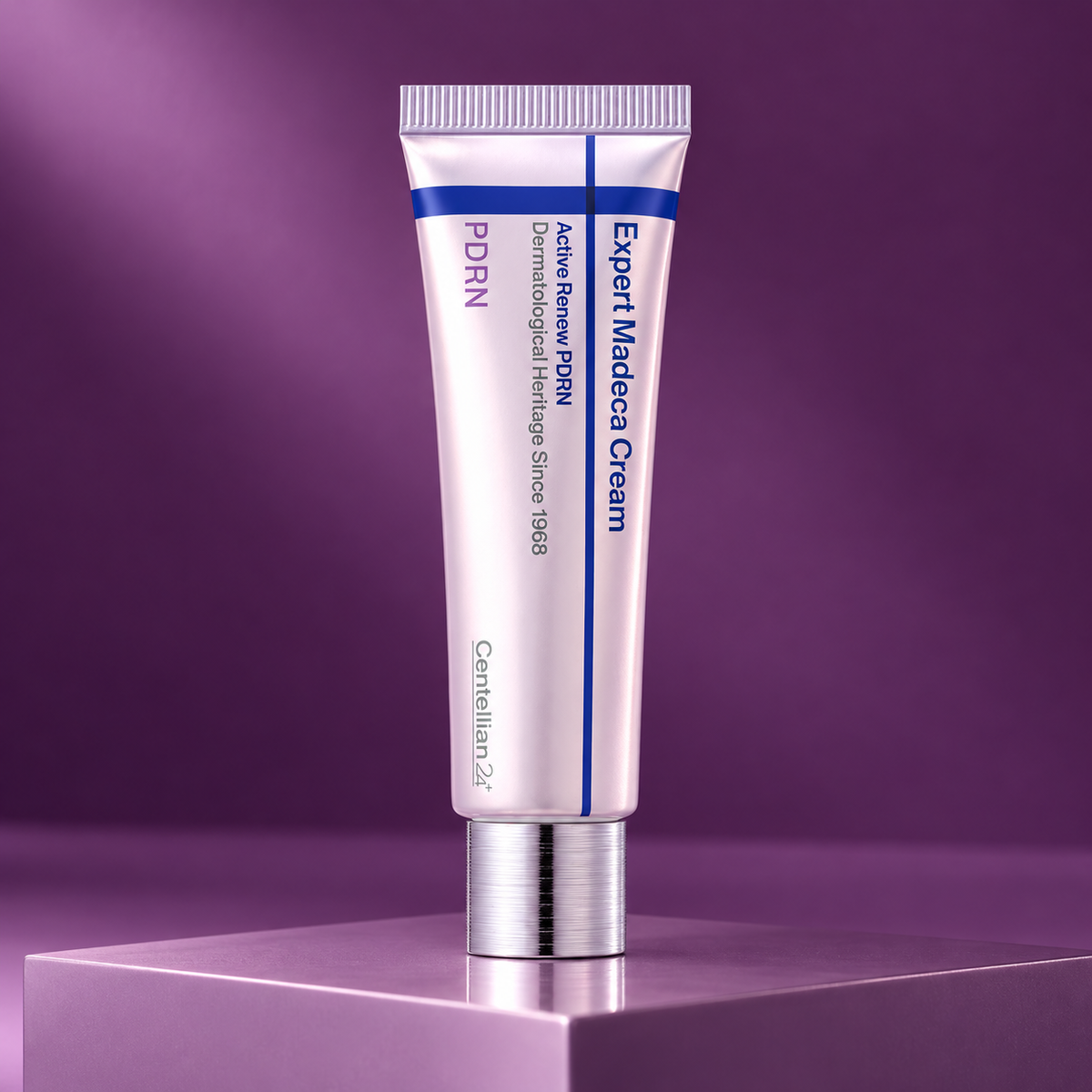 Centellian24 Expert Madeca Cream Active Renew PDRN tube on a plum studio plinth.