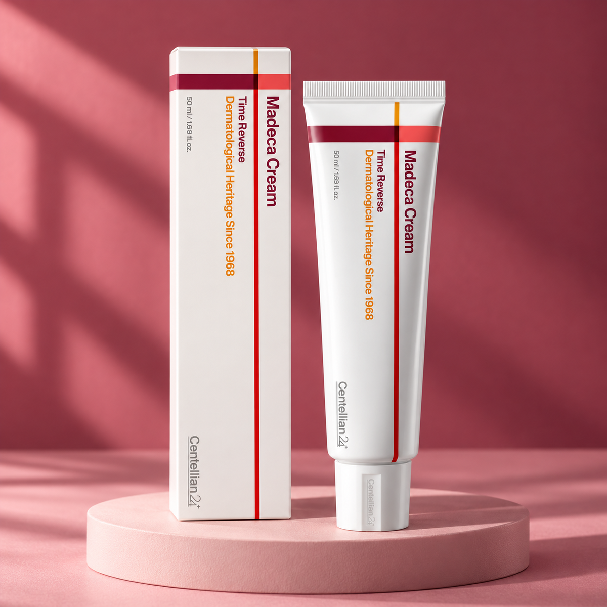 Centellian24 Madeca Cream Time Reverse 50 ml tube and carton on a rose-colored studio pedestal