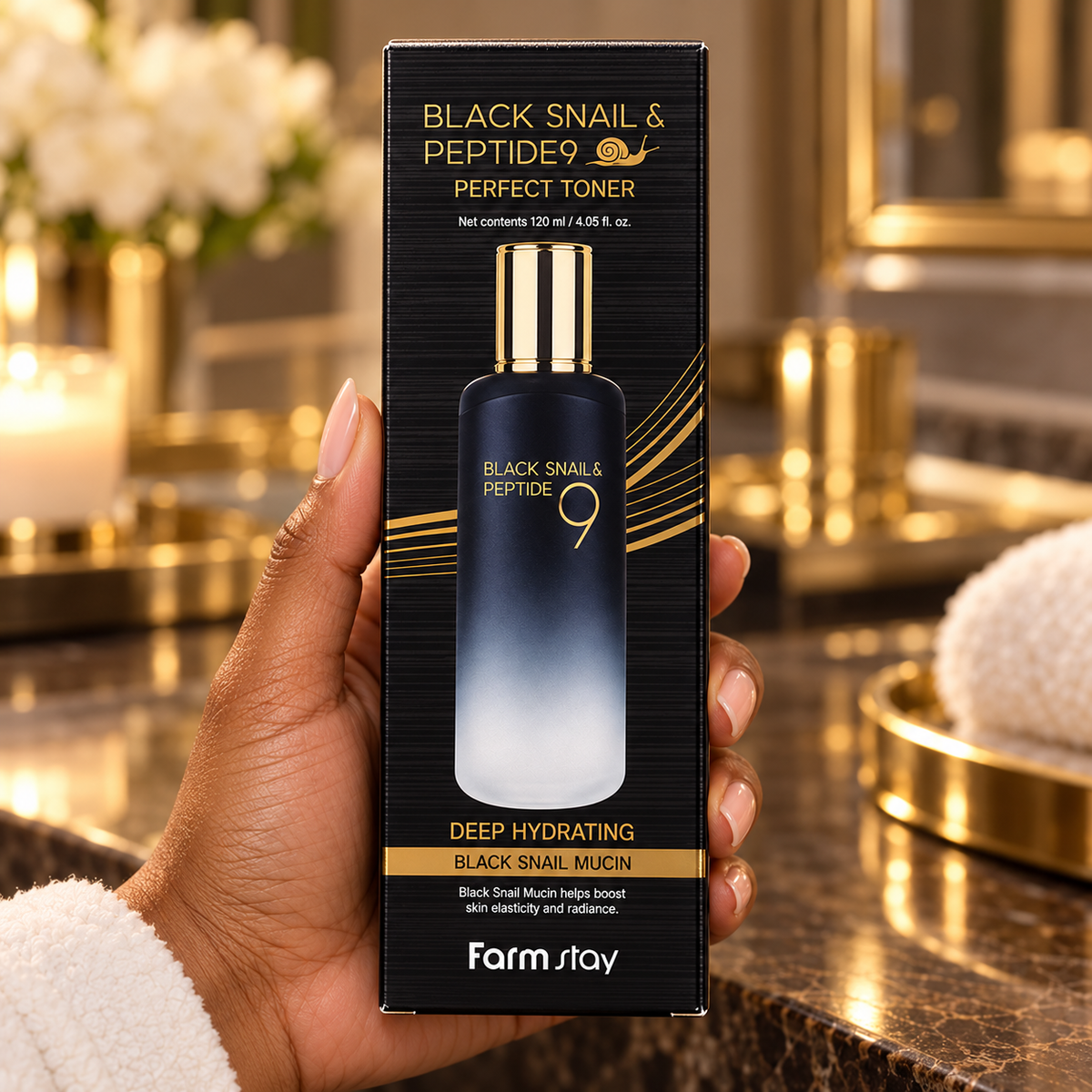 Front-label close-up of the original Farmstay Black Snail & Peptide9 Perfect Toner 120 ml carton held in a hand at a warm home vanity.