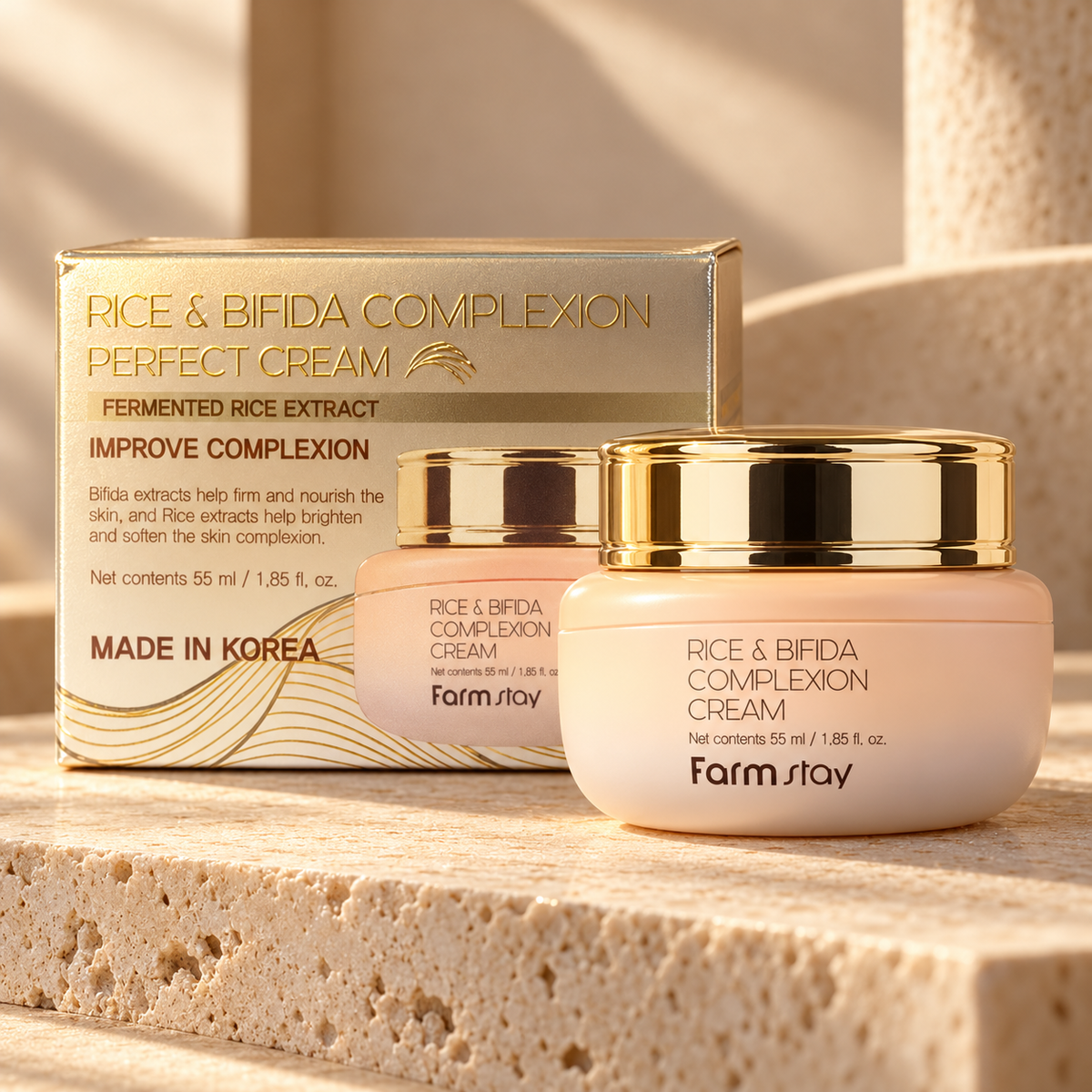 Farmstay Rice & Bifida Complexion Cream 55 ml jar with matching carton on warm stone