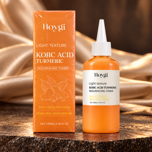 HOYGI Kojic Acid Turmeric Resurfacing Toner — 100 ml orange bottle with closed white nozzle cap beside matching carton