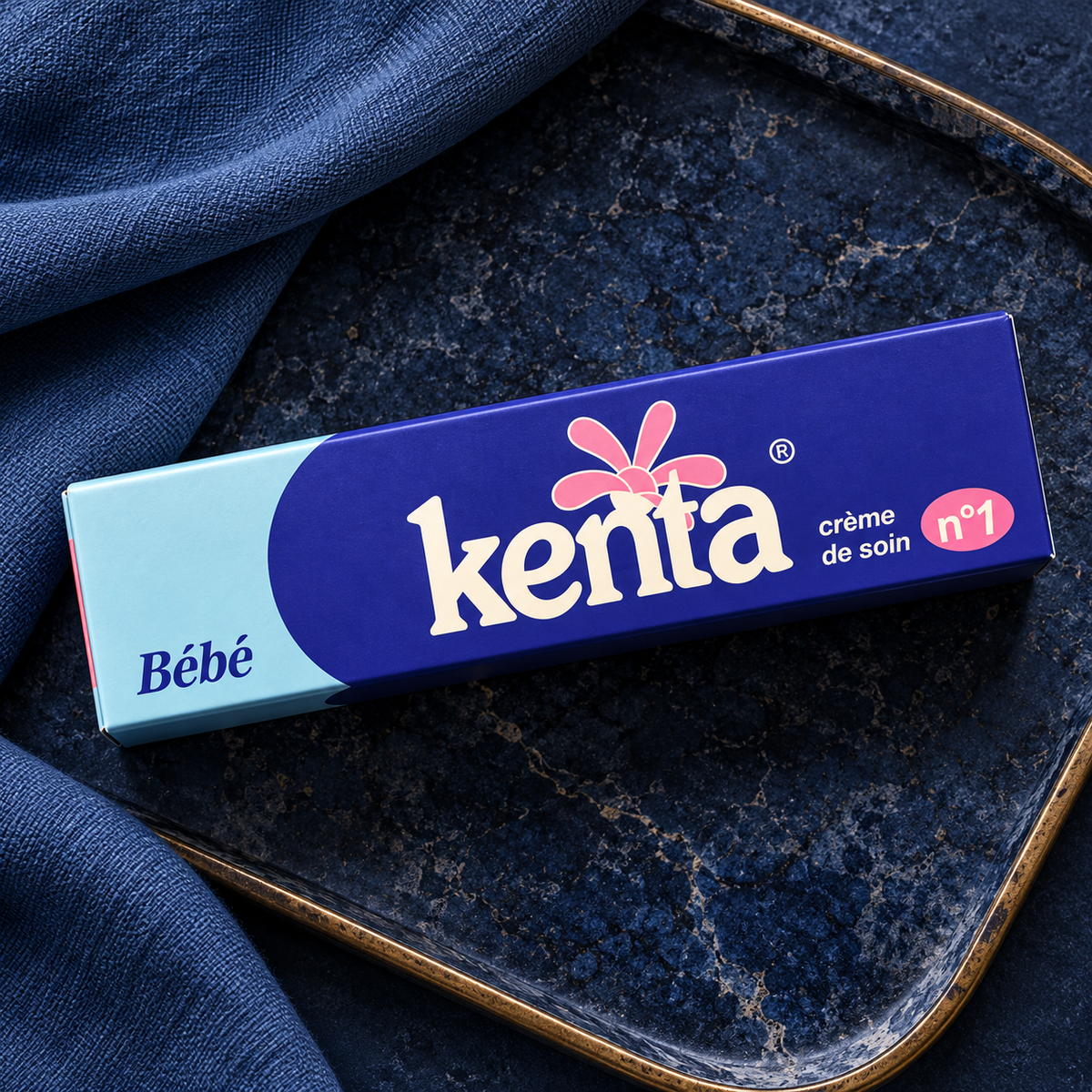 Single closed Kenta Bébé Crème de Soin n°1 carton in a top-down navy flatlay