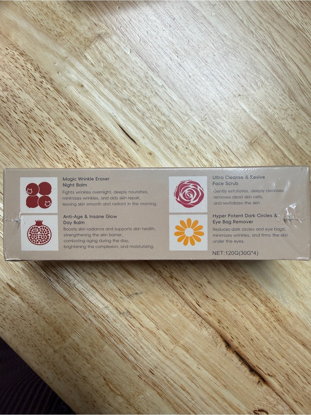 Physical sealed-carton reference photograph showing the four printed product names, colored icons and NET 120G (30G x 4).
