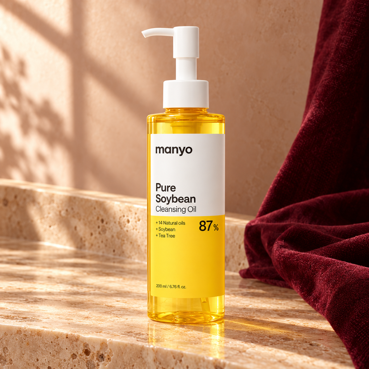 ma:nyo Pure Soybean Cleansing Oil 200 ml in an original travertine and burgundy scene