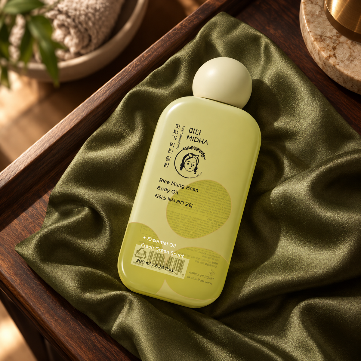MIDHA Rice Mung Bean Body Oil — 200 ml — closed packaging detail; props not included.