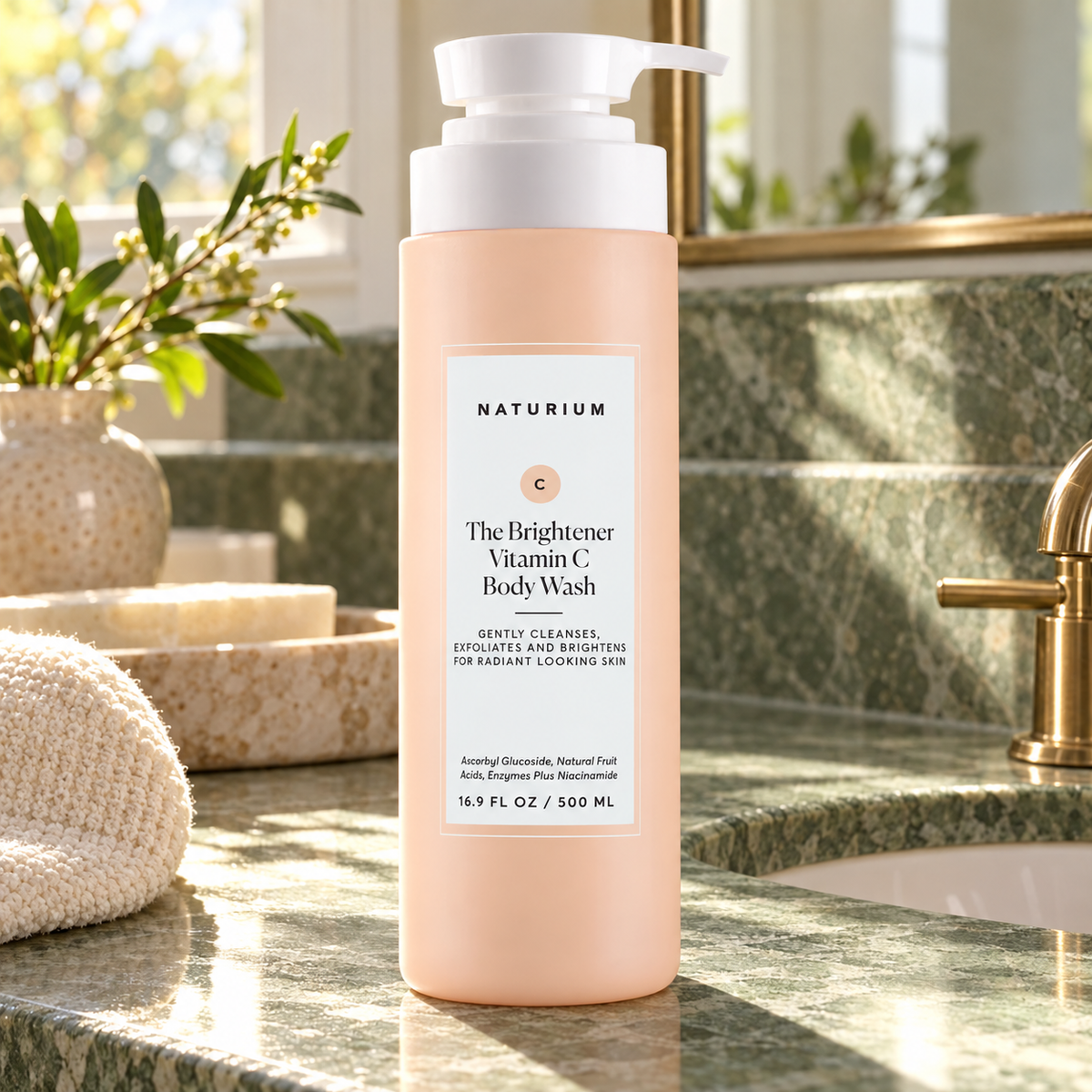 NATURIUM The Brightener Vitamin C Body Wash 500 ml on bathroom vanity