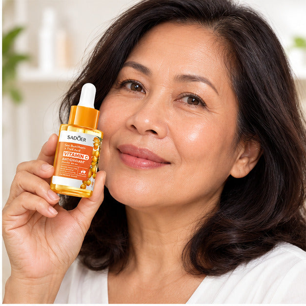 SADOER Sea Buckthorn Vitamin C Serum held by an adult woman