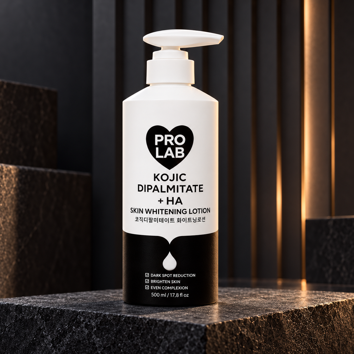 PRO LAB Kojic Dipalmitate + HA Body Lotion 500 ml pump bottle in a graphite studio setting; styled product photograph.