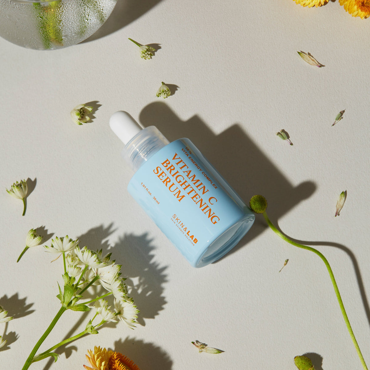 SKIN&LAB Vitamin C Brightening Serum 30 ml — bottle with botanical scene