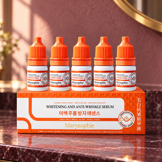 Marysophie five capped serum vials with their orange and white carton on a plum stone vanity