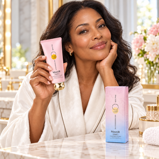 Adult woman holding MmeiR facial cream at a bright vanity