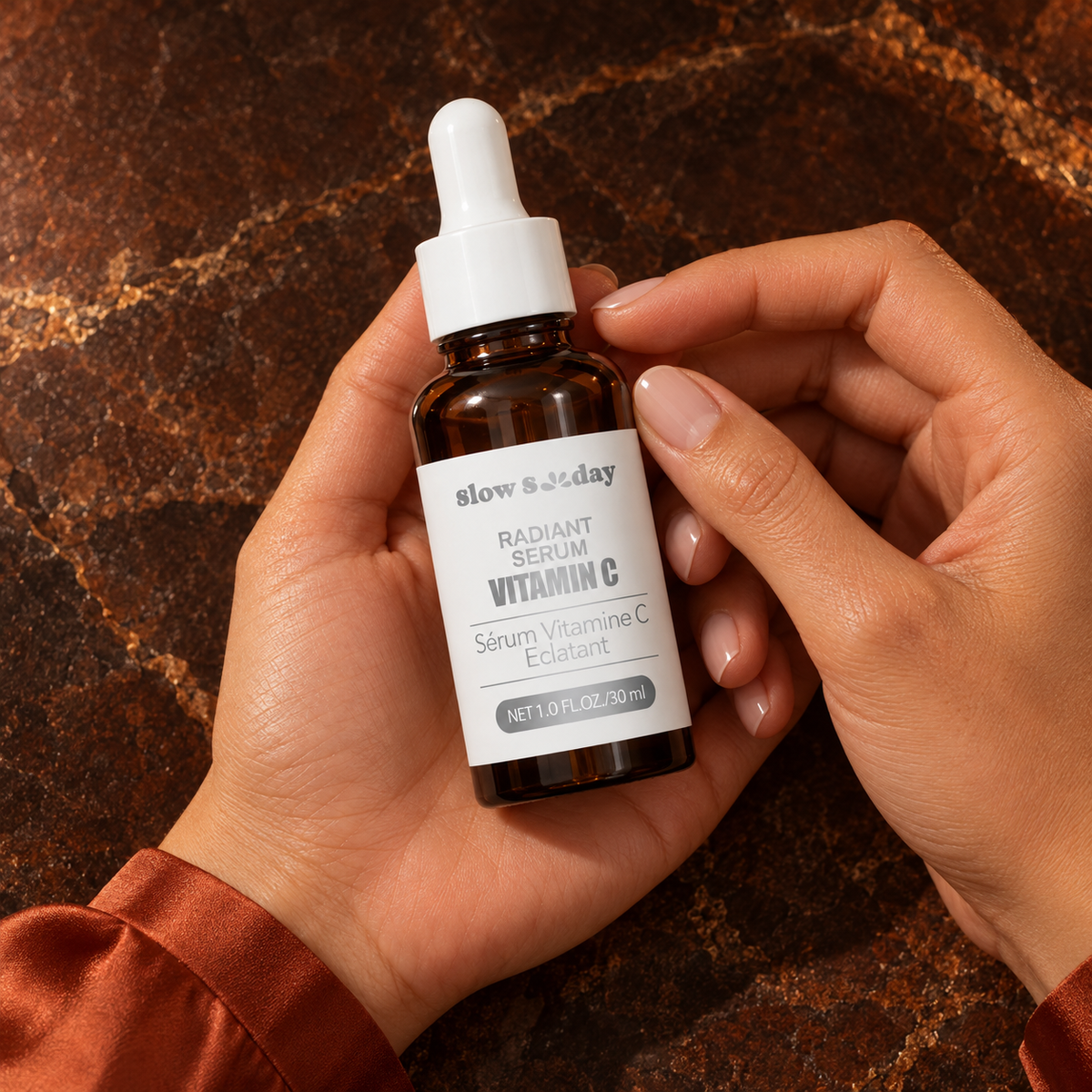 Slow Sunday Radiant Vitamin C Serum — 30 ml; closed bottle front-label detail in the same woman's hands