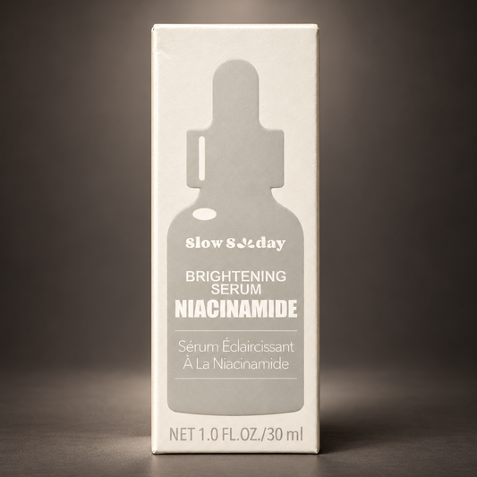 Slow Sunday Brightening Niacinamide Serum 30 ml carton on a charcoal studio background