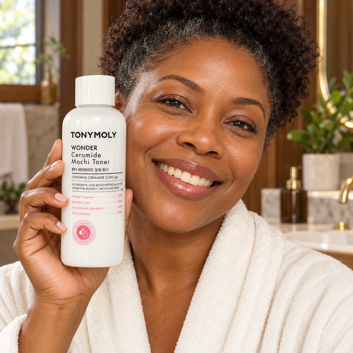 Model holding TONYMOLY Wonder Ceramide Mochi Toner