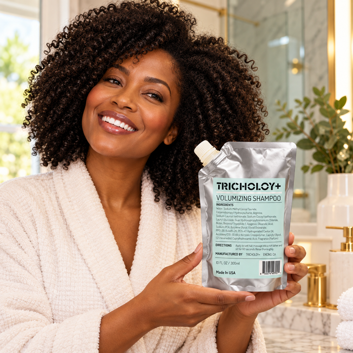Woman presenting TRICHOLOY volumizing shampoo 300 ml pouch in a home bathroom